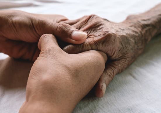 Caring hands touching